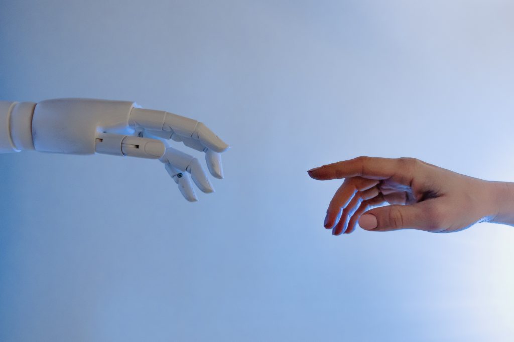 Image of human hand and robot hand